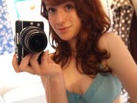 Cute redhead babe takes nude selfies