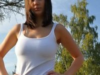 Girl posing topless outdoors
