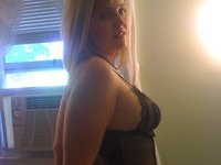Amateur blonde posing topless