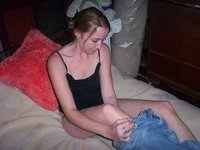 Young amateur wife posing on bed