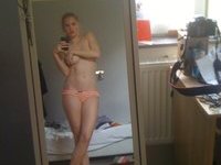 Young blond girl posing in sexy lingerie