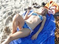 Blond milf sunbathing topless