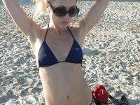 Blond milf sunbathing topless