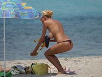 Amateur girl sunbathing topless
