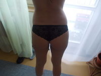 Young nice girl in thongs and naked