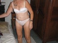 Mature wife undressing