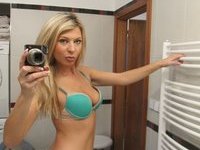 Amazing blonde girl selfies at bathroom