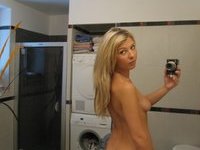 Amazing blonde girl selfies at bathroom