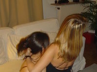 Two girls kissing and licking