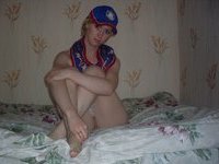 Redhair girl posing on bed