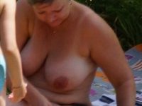 Large titted MILF caught topless at river