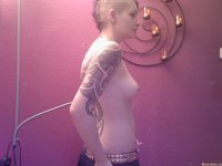 Young tattooed girl with piercing