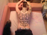 Young tattooed girl with piercing