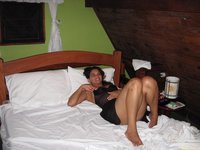Sweet girlfriend posing in hotel room