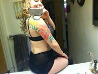 Tattooed naked girl homemade posing selfie