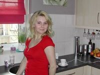 Blond amateur MILF posing at home