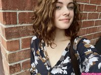 Cute curly haired girlfriend making selfie