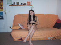 Teen playing naked on her bed