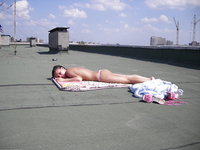 Two GFs sunbathing topless at roof