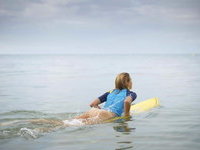 surfer girl losing her pants