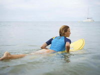 surfer girl losing her pants