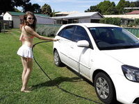 Sexy naked teen washes her car
