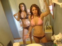 Sexy curly haired twin teen sisters