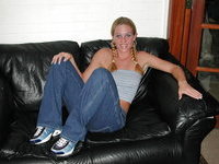 Blonde amateur wife posing on sofa