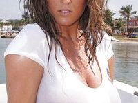 Big tits beauty MILF posing at beach