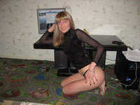 Blonde amateur girl posing in her room