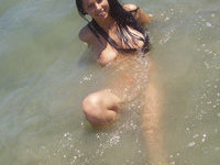 Young latina GF tanning her tits at beach