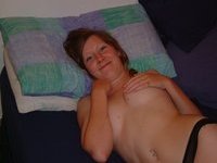 Redhead amateur GF posing on bed