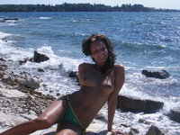 Hot MILF topless at beach