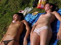 Two amateurs sunbathing topless