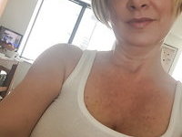 Mature amateur blonde mom shows off her hairy twat