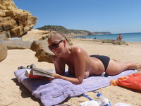 Curvy vacation MILF topless on beach