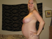 MILF shows off huge tits on pregnant body