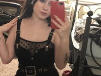 Sexy goth teen shows her pierced tits and round ass