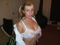 Beautiful blonde wife posing at home