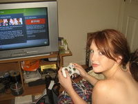 Redhead young gamer girl
