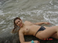 Four cute amateur girls topless at seaside