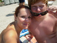 Teenage amateur couple at vacation with friends