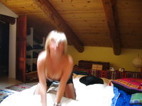 Hairy horny blonde wife posing on bed