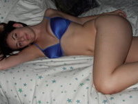 Brunette amateur GF posing on bed