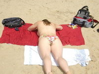 Daria posing topless at beach
