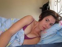 Young amateur wife posing at bedroom