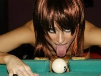 Sexy redhead girlfriend in stockings at pool table