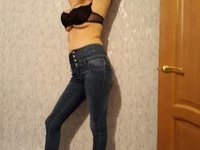 Horny busty MILF strips jeans to masturbate passionately