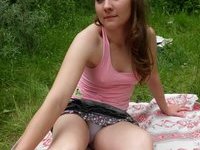 Amateur sweetie plays with her pussy outdoors