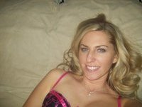 Sexy amateur blonde wife posing on bed